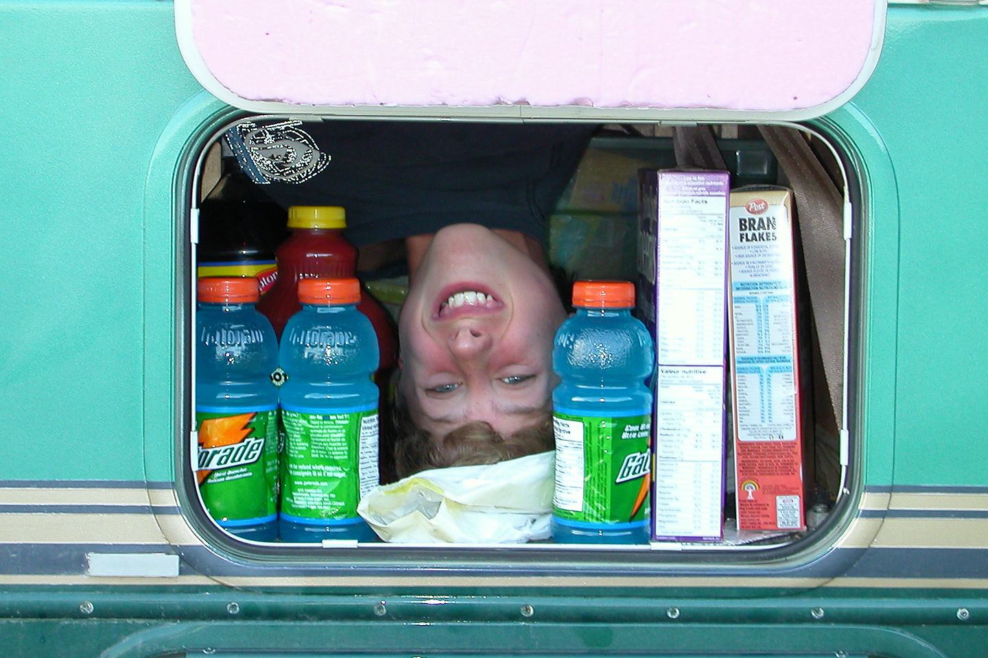 Tommy checking RV storage under seat