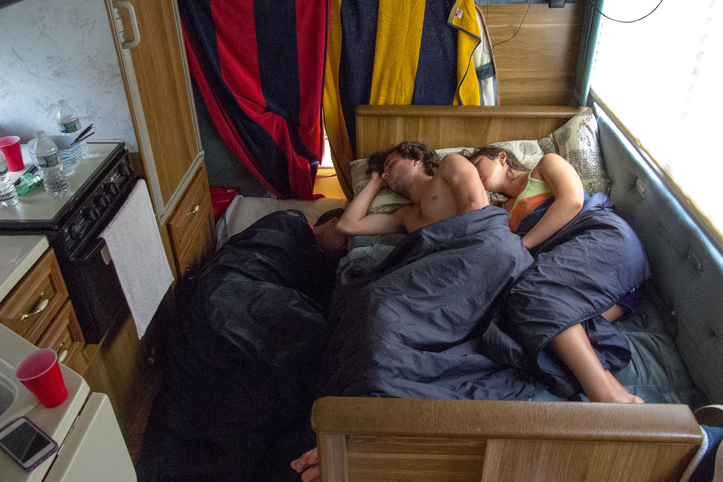 Kids and Celeste Sleeping in RV Kitchen