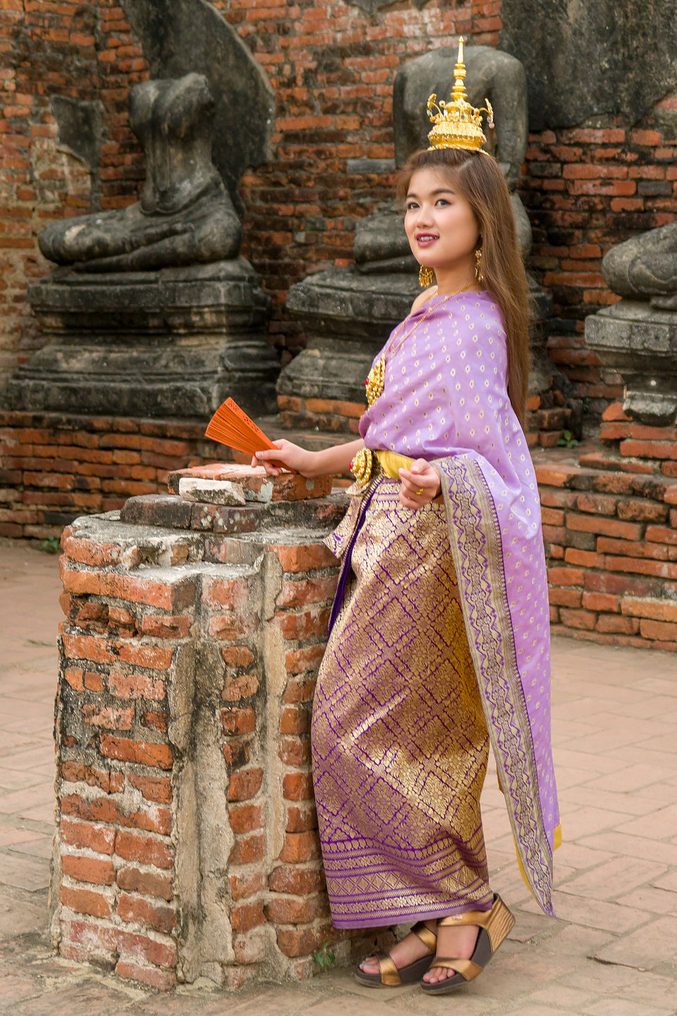 Traditional Thai dress at Chai Watthanaram Temple