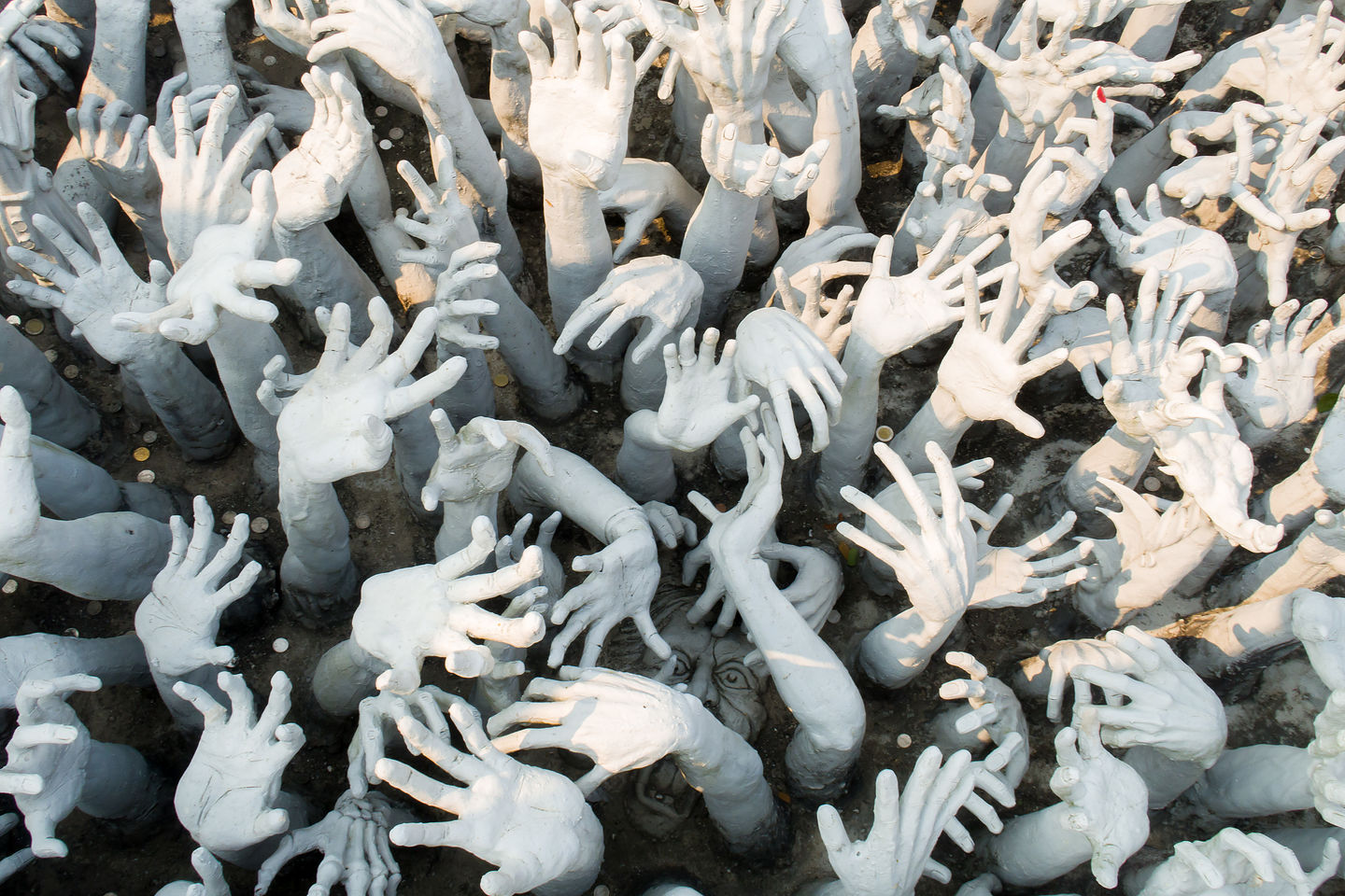 The beseeching hands of the suffering at the White Temple