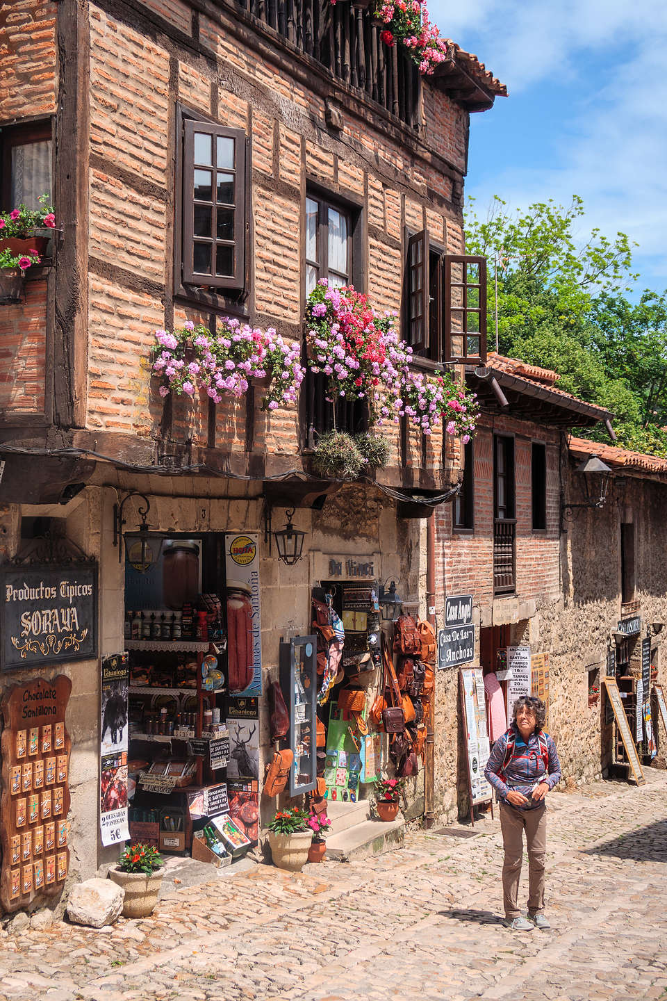 Lolo wandering along the cobblestone streets of Santillana del Mar