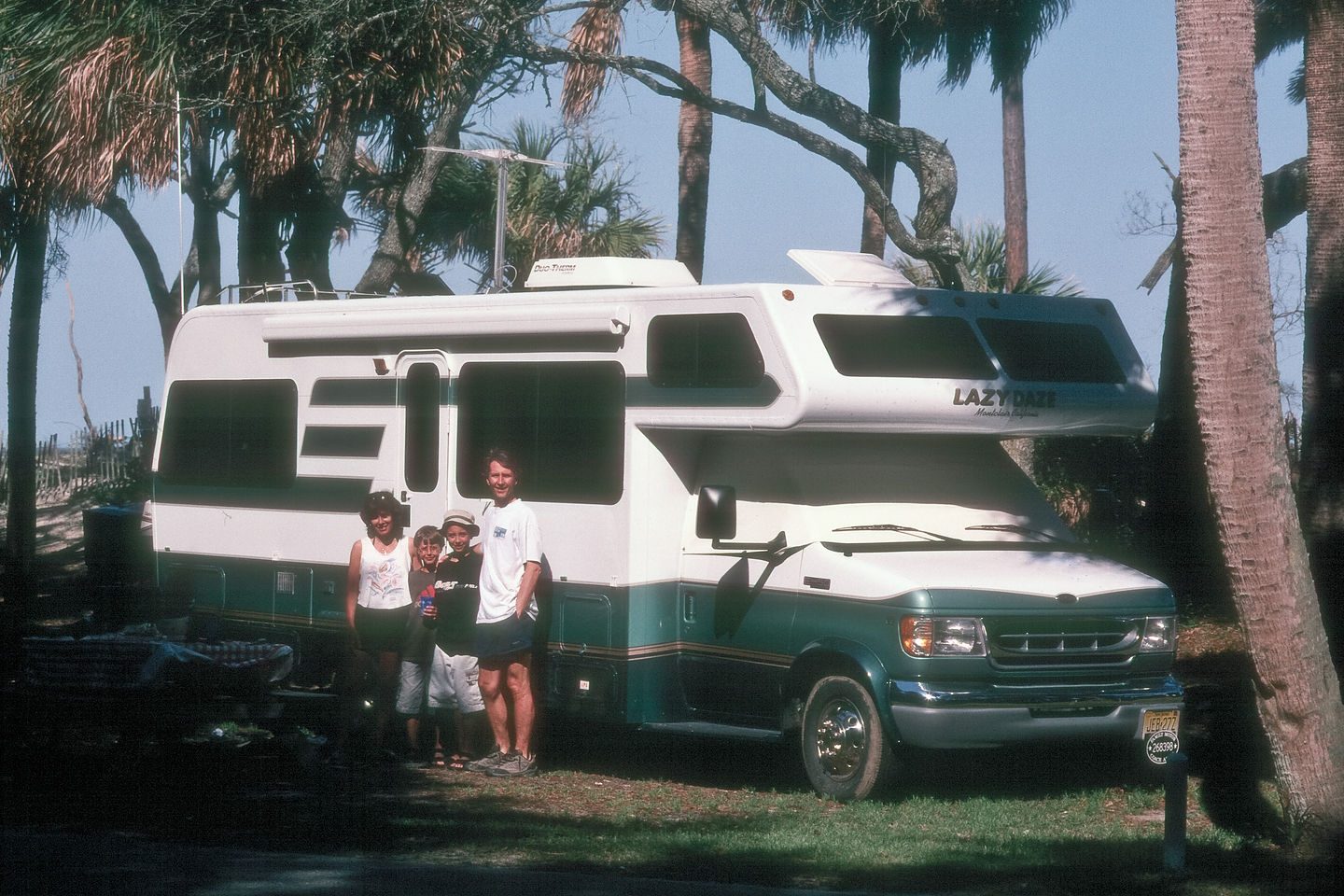 Family with Lazy Daze on beachfront campsite